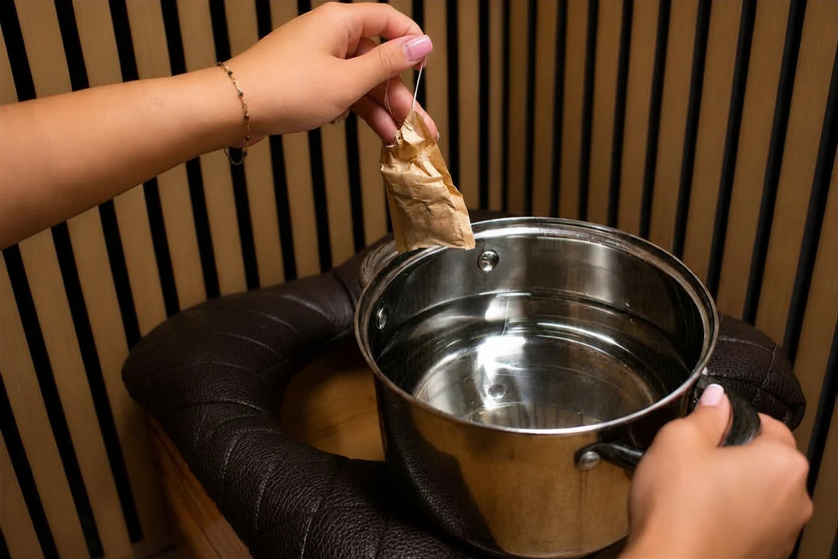 Body by Shae yoni steaming setup with an herbal sachet and steaming vessel